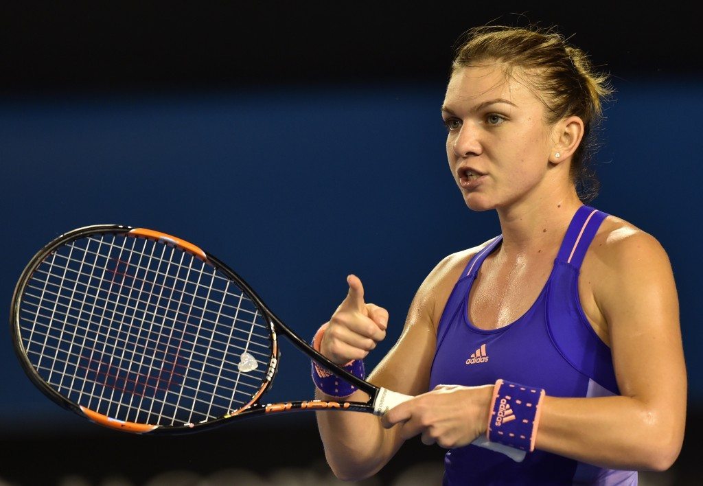 Romania's Simona Halep gestures during her women's singles match against Australia's Jarmila Gajdosova on day three of the 2015 Australian Open tennis tournament in Melbourne on January 21, 2015. AFP PHOTO / PAUL CROCK -- IMAGE RESTRICTED TO EDITORIAL USE - STRICTLY NO COMMERCIAL USE